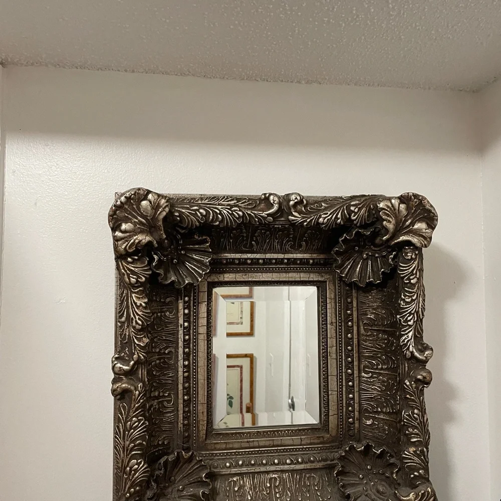 Beautiful carved mirror with little pearls in the oyster shells and much carving
